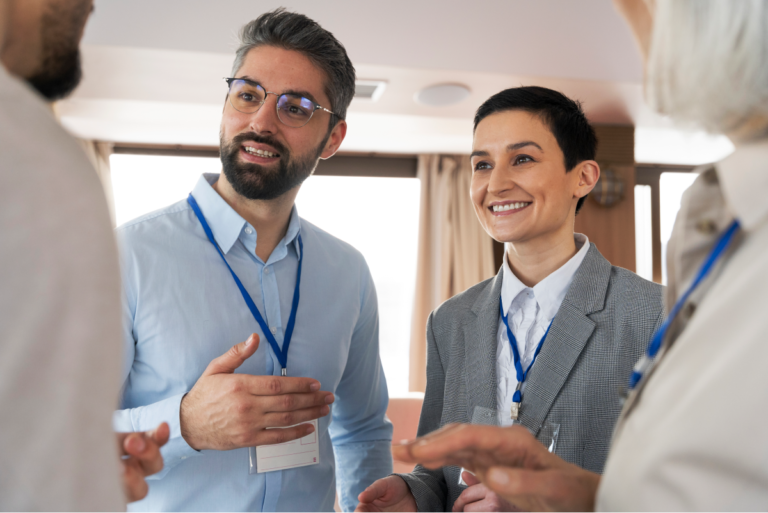 A group of people attending a business event, networking and discussing