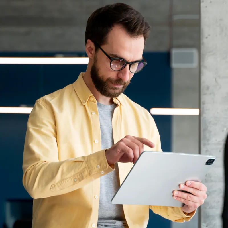 Serious employee using iPad
