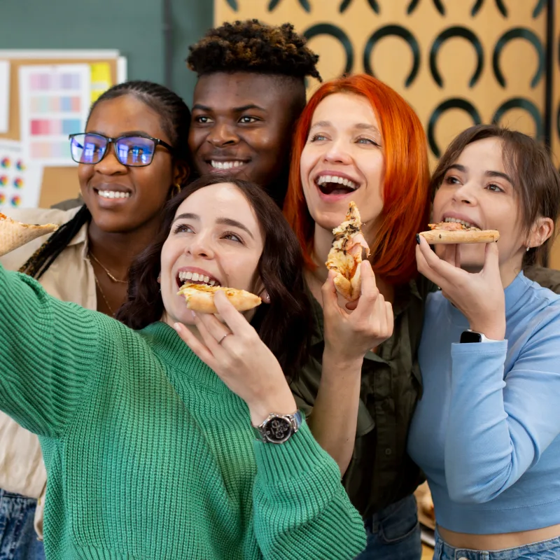 Group of five employees taking a selfie during lunch break