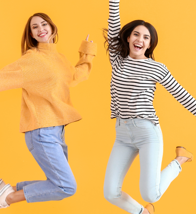Jumping women on colorful background